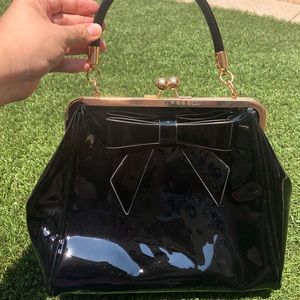 Vintage Banned Retro Black Handbag with Kiss-lock and Iconic Bow